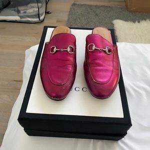 Gucci metallic pink slides.